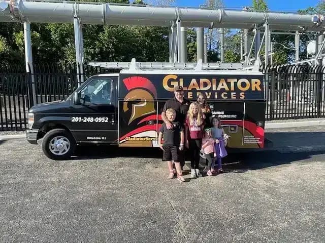 Gladiator family in front of truck in Hillsdale, NJ.