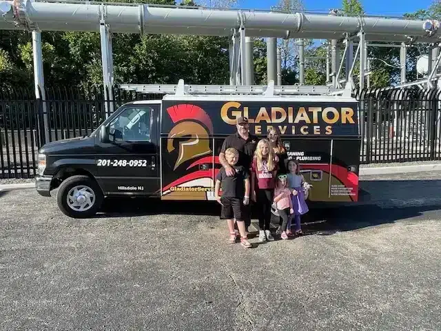 Gladiator family in front of truck in Hillsdale, NJ.